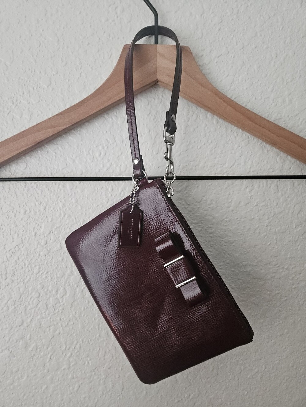 coach mahogany wristlet with bow